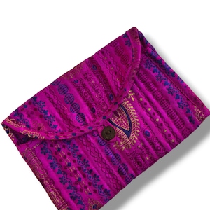 May include: A rectangular fabric pouch in vibrant magenta featuring vertical stripes with intricate blue and gold patterns. The flap is secured by a single dark brown wooden button centred on the front, showcasing a detailed textile design.