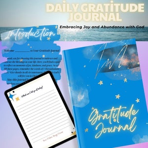 May include: A blue gratitude journal with gold lettering and star accents, next to a tablet displaying journal prompts. The journal cover reads "Gratitude Journal" and "Daily Gratitude Journal". The tablet shows the prompt "What can I let go of today?"