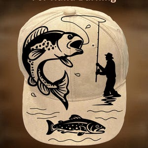 May include: A beige baseball cap with a black graphic of a fish jumping and a fisherman. The text "For Hand Burning" and "CoolMoonDesigns" are printed on the cap. The design is suitable for fishing enthusiasts.