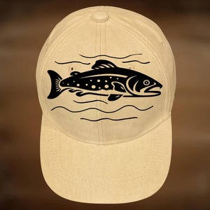 May include: A beige baseball cap with a black graphic of a fish and water lines. The text "For Hand Burning" is above the cap, and "CoolMoonDesigns" is below.