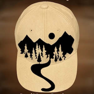 May include: Tan baseball cap with a black mountain and forest silhouette design. The cap features the text "For Hand Burning" and "CoolMoonDesigns".