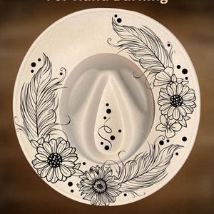 May include: Cream-coloured fedora hat with black floral and feather designs. The hat features the text "For Hand Burning" and "CoolMoonDesigns". The brim is decorated with sunflowers, feathers, and dots.