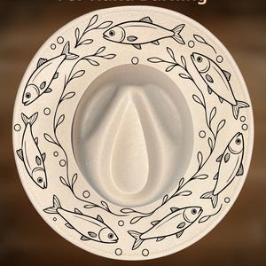May include: A cream-colored fedora hat featuring a black line art design of six fish swimming in a circular pattern among seaweed and bubbles. The text "For Hand Burning" appears at the top and "CoolMoonDesigns" at the bottom of the image.