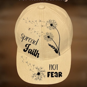 May include: A beige baseball cap with a black dandelion design and the words "spread Faith NOT Fear." The text "For Hand Burning" and "CoolMoonDesigns" are also visible on the cap.