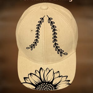 May include: A beige baseball cap with a black sunflower design on the front and leaf accents. The text "For Hand Burning" and "CoolMoonDesigns" are also visible on the cap.