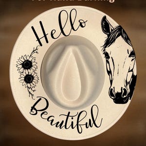 May include: A cream-coloured fedora hat featuring a black hand-burned design of a horse head, two sunflowers, and the text "Hello Beautiful". The text "For Hand Burning" appears at the top and "CoolMoonDesigns" at the bottom of the image.