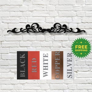 May include: Black metal scrollwork design with a decorative flourish. The scrollwork is available in black, red, white, copper, and silver.