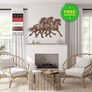 May include: Metal wall art featuring three horses running, available in black, red, white, copper, and silver. The art is displayed on a white wall above a fireplace in a living room setting.