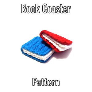 May include: Two crocheted coasters shaped like small books, one with a blue cover and white pages, the other with a red cover and white pages. The text "Book Coaster" appears at the top and "Pattern" at the bottom of the image.