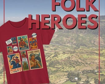 May include: A red t-shirt featuring postage stamp designs of American folk heroes, including Johnny Appleseed and Pecos Bill. The words "FOLK HEROES" are displayed in large red letters above the shirt, with "FOLKSTAMP" below. The background shows a scenic landscape.