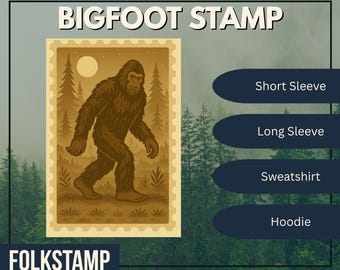 May include: A Bigfoot stamp design with the text "BIGFOOT STAMP" at the top and "FOLKSTAMP" at the bottom. The stamp features a brown Bigfoot walking in front of a forest scene with a full moon. Options for Short Sleeve, Long Sleeve, Sweatshirt, and Hoodie are listed.