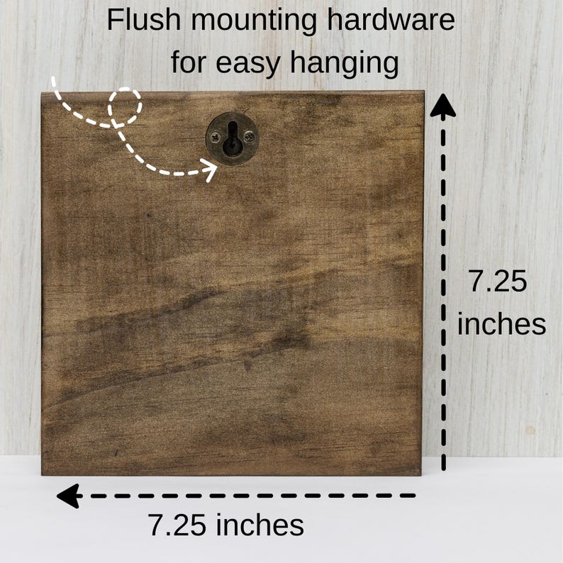 May include: A brown wooden square sign with a metal hanging hook. The sign measures 7.25 inches by 7.25 inches.