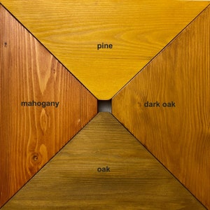 May include: Close-up of four wood samples, each labeled with its type: mahogany, pine, dark oak, and oak. The wood samples are arranged in a diamond shape.