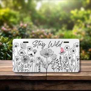 Wildflower license plate, cute license plate for her, car gift, car decor, car aesthetics. Stay Wild front license plate.