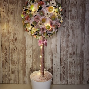 Rosa und Schwarzer Blumenlollipop süßer Baum