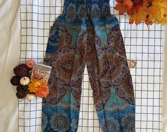 May include: Blue and brown patterned pants with an elastic waistband. The pants have a bohemian style and are made of a lightweight fabric.