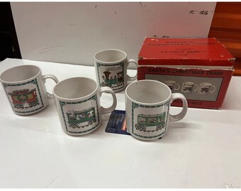 Taza de café con el diseño del tren navideño de Papá Noel. Exclusiva de Ron Gordon Designs, 1986.