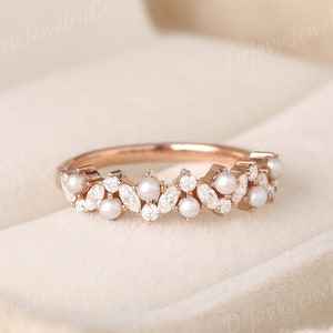 This exquisite ring is not only perfect as a wedding band but also makes for a beautiful promise ring or an anniversary gift for the women who appreciates vintage charm and modern sparkle.
