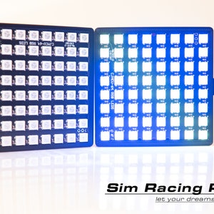 Könnte beinhalten: Zwei schwarze Leiterplatten mit jeweils 64 RGB-LEDs. Die Leiterplatten sind durch ein USB-Kabel verbunden. Der Text "CJMCU-64 RGB LEDS" ist auf den Leiterplatten aufgedruckt. Der Text "Sim Racing Parts let your dreams come true" ist unter den Leiterplatten aufgedruckt.