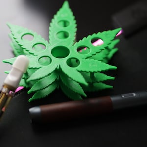 葉っぱの形をした510ベイプカートリッジとペンホルダー