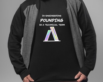 May include: A black t-shirt with the text "In engineering, pounding is a technical term" and a rainbow-colored graphic of two triangles.