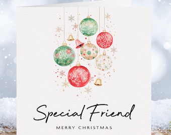 May include: A Christmas card with a watercolor illustration of red and green ornaments with gold accents. The text "Special Friend Merry Christmas" is printed on the card.