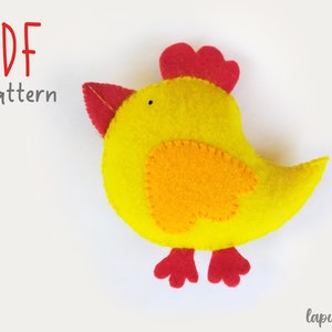 May include: PDF pattern for a felt chick toy. The chick is yellow with orange accents and red feet and comb.