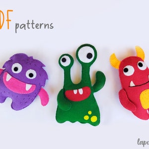 Puede incluir: Tres patrones de peluche de monstruo de fieltro en formato PDF. Los monstruos son morado, verde y rojo con diferentes rasgos faciales y colores.