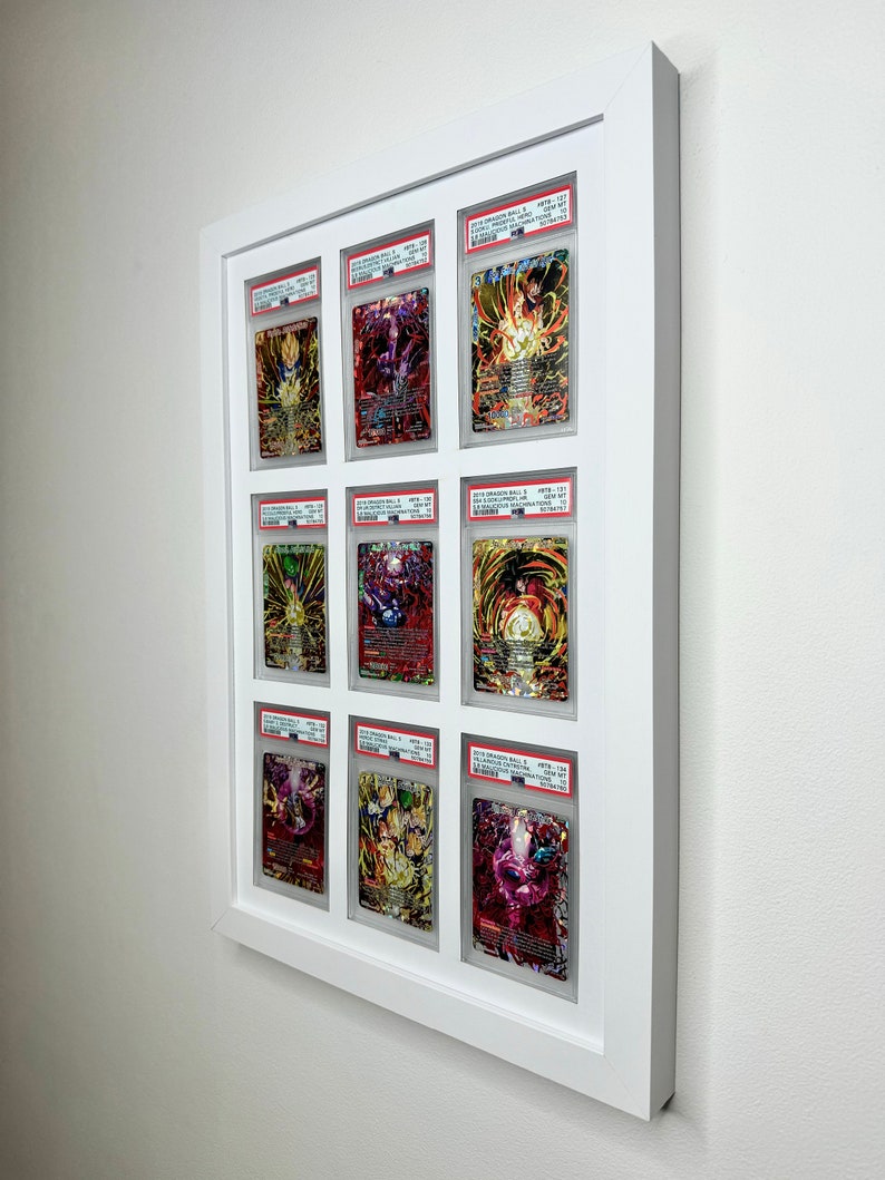 May include: Nine Dragon Ball Super trading cards are displayed in a white frame. The cards are graded and encased in protective plastic. The cards feature various characters from the Dragon Ball Super anime series.