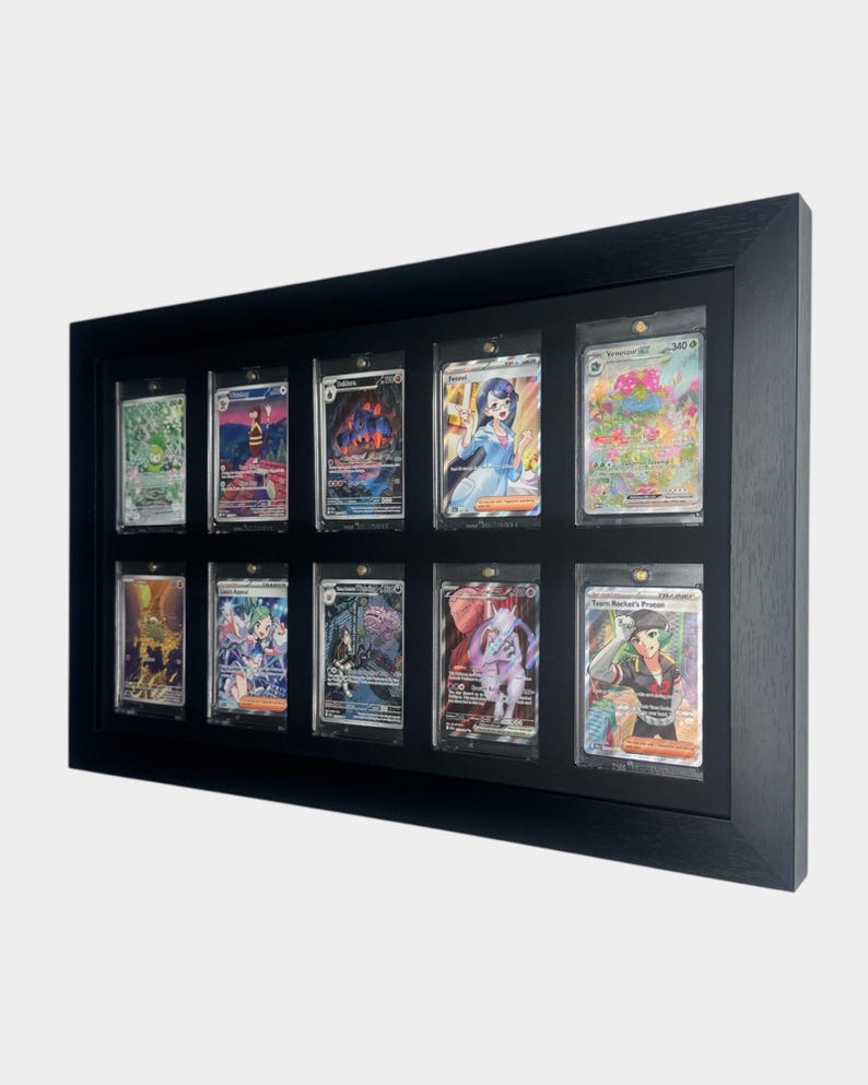 May include: A black wooden display frame holding twelve collectible trading cards. Each card is encased in a clear protective sleeve. The cards feature colorful illustrations and text, showcasing a variety of characters and scenes.