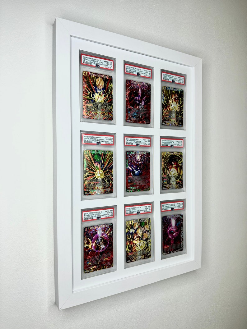May include: Nine Dragon Ball Super trading cards are displayed in a white frame. The cards are graded and encased in protective plastic. The cards feature various characters from the Dragon Ball Super anime series.