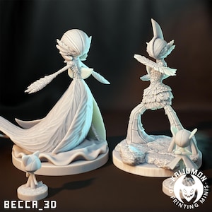 May include: Two white 3D-printed figurines of fantasy characters. One figure is a tall, slender woman in a flowing gown, and the other is a more stylized, angular figure. A small, matching figurine is at the base of each larger figure. The text "BECCA_3D" is at the bottom.