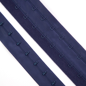 May include: Two strips of dark navy blue bra extender tape. One strip features a single row of metal hooks, while the other wider strip contains two parallel rows of metal eyes, designed for adjusting the fit of undergarments.