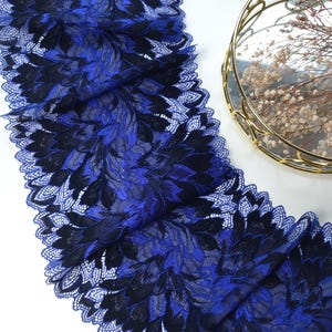 May include: Blue and black floral lace trim with a scalloped edge.