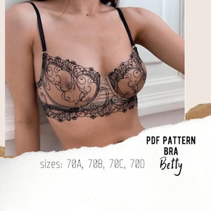 Könnte beinhalten: Ein beiger BH mit schwarzen Spitzendetails und verstellbaren Trägern. Der BH hat ein zartes Blumenmuster an den Rändern und Körbchen. Der Text auf dem Bild lautet "PDF PATTERN BRA Betty" und "sizes: 70A, 70B, 70C, 70D".