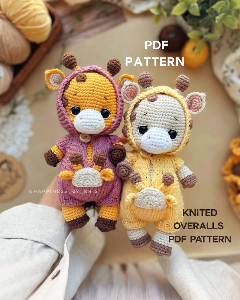 May include: Two crocheted giraffe dolls in hooded overalls. One doll is in a yellow outfit, the other in a pink outfit. The dolls have brown spots, ears, and horns. The text "PDF PATTERN" and "KNITTED OVERALLS PDF PATTERN" is visible.