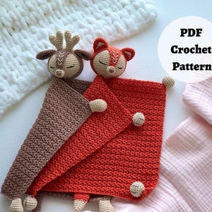 Peut inclure: Un mod&egrave;le de crochet pour une couverture b&eacute;b&eacute; avec un jouet amigurumi de cerf et de renard. La couverture est marron et orange et les jouets sont beiges avec des yeux marrons. Le mod&egrave;le est disponible en t&eacute;l&eacute;chargement PDF. Mod&egrave;le de crochet PDF