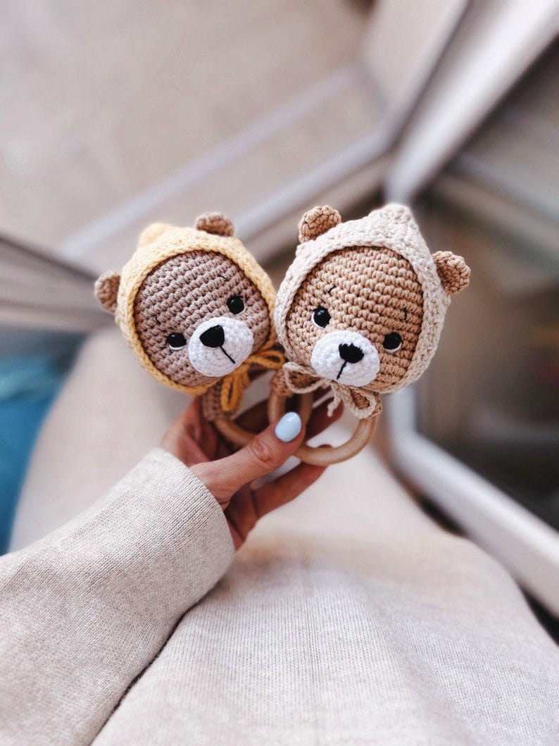 Rattle Crochet Pattern Soothing Teddy Bear in Cap With Ties on Wooden ...