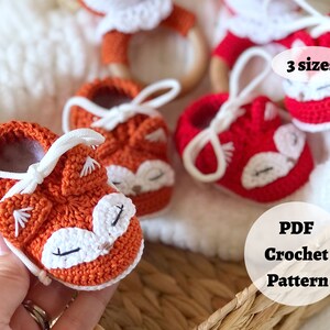 May include: Crochet pattern for a pair of orange fox baby booties with white accents. The pattern is available in three sizes and is a PDF download.