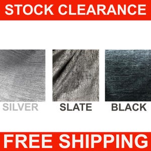 May include: Three fabric swatches in silver, slate, and black. The fabric has a textured, woven look.  STOCK CLEARANCE and FREE SHIPPING are written in red text at the top and bottom of the image.