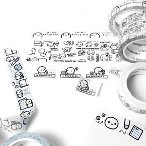 May include: A collection of decorative washi tape rolls and stickers with black and white illustrations. The designs include cartoon figures, text, and phrases like "In Progress" and "Get it Done". The tape is ideal for planners and crafts.