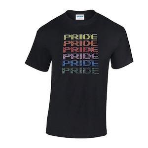 May include: Black t-shirt with the word "PRIDE" repeated five times in a rainbow pattern. Each "PRIDE" is made up of small dots in different colours.