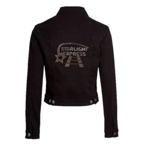 May include: Black denim jacket with button closures and a classic collar. The back features a rhinestone design with the words "STARLIGHT EXPRESS" and a star. A stylish and versatile outerwear piece.