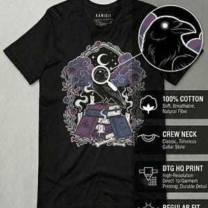 May include: Black crew neck t-shirt with a graphic featuring a raven, books, candles, and a crescent moon. The design includes the text "KAMIOJI" and product details: 100% cotton, crew neck, DTG HQ print, and regular fit.