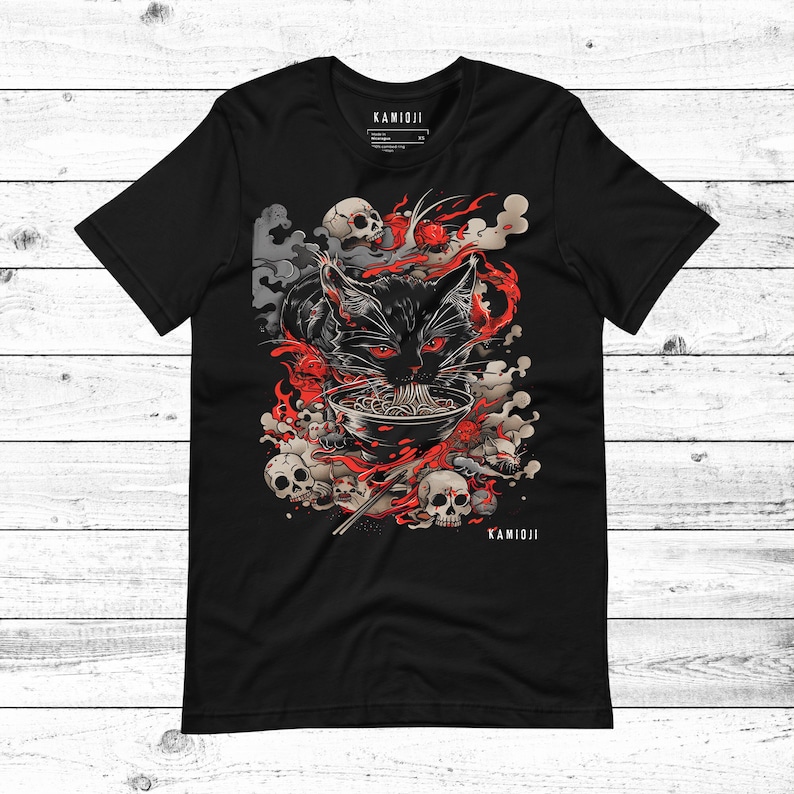 Cat shirt inspired by Junji Ito’s horror art, featuring a black cat in a graphic ramen bowl design. Perfect for fans of dark art and Y2K streetwear. A unique KAMIOJI piece for alt clothing and weirdcore fashion lovers. BLACK.