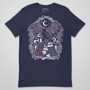 Witchcraft themed graphic with crow, candles, and spell books. Navy.