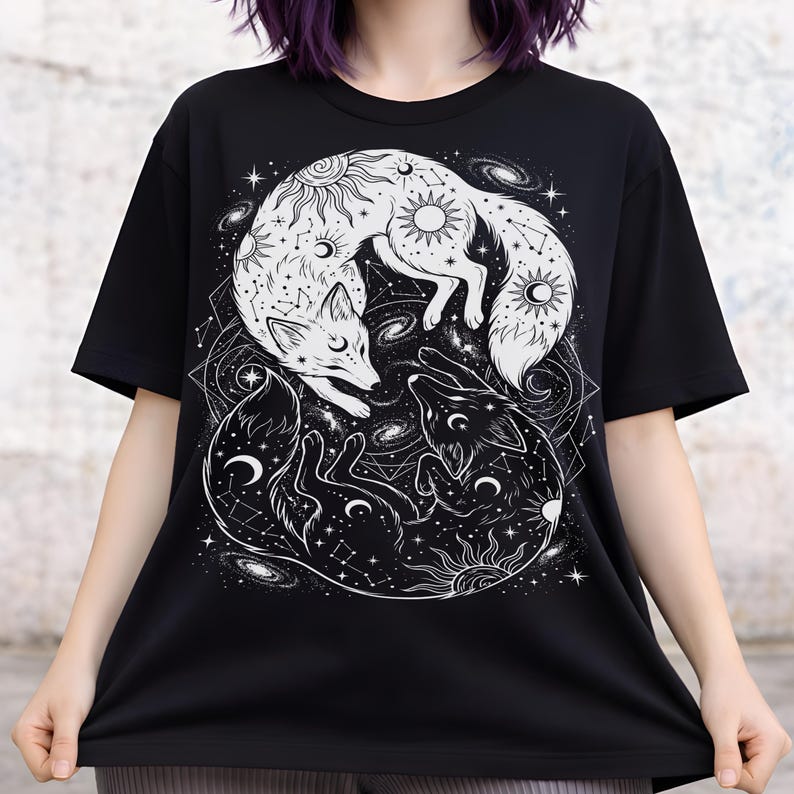 Black and white fox shirt featuring two curled foxes in a yin yang formation with sun, moon, and constellation details in white ink.