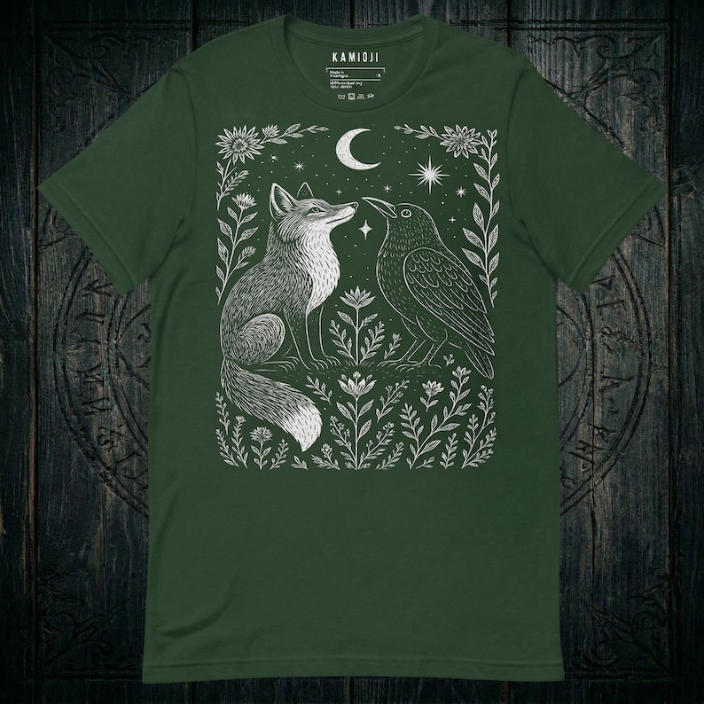 Women's crow shirt with a dark academia aesthetic and detailed gothic illustration. Forest green color variation.