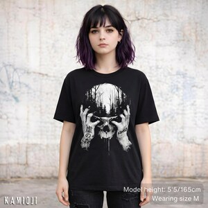 Alternative gothic clothes with a skull design, eerie forest backdrop. Unisex fit.