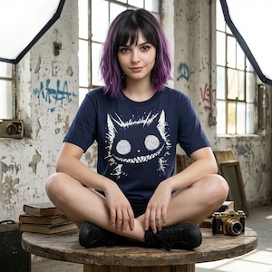 Horror-themed cat shirt with Alice-inspired dark art. Designed for lovers of weirdcore, emo, and alternative fashion. Navy color.